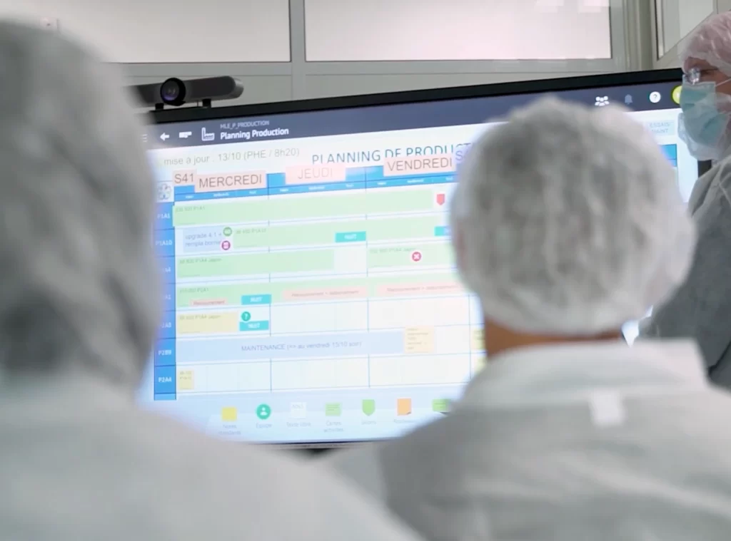 Pharmaceutical team using iObeya, a digital visual management solution, to plan production